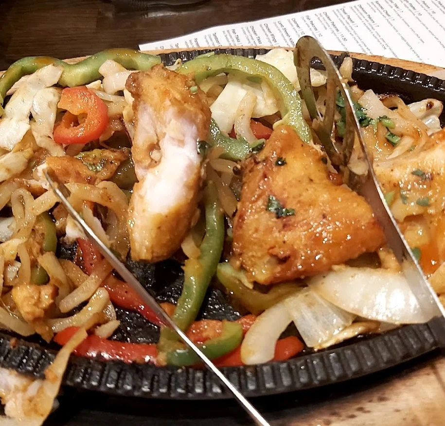 Fish tikka served on a sizzler at Ginger Indian Cuisine, Richmond BC